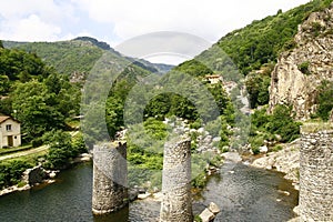 The ruins of a bridge over the river Borne photo