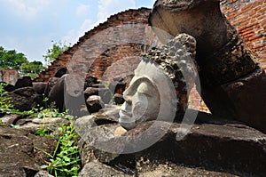 Ruins of Buddha images and temple in historical park of Thailand