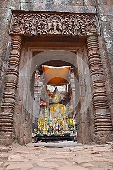 Ruins buddha statue image in archaeological site at Vat Phou or Wat Phu