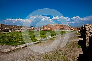 Ruins of the Building of Eumachia in the ancient city of Pompeii in a beautiful early spring day