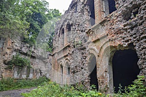 Ruins of buildings within in abandoned Tarakaniv Fort in the summer cloudy day, Ukraine