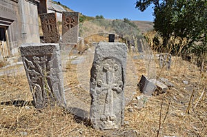 Ruins of buildings and khachkars 5-7 centuries in an ancient monastery Tsahats-kar in Armenia