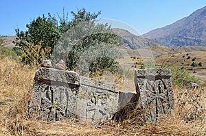 Ruins of buildings and khachkars 5-7 centuries in an ancient monastery Tsahats-kar in Armenia
