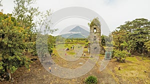 The ruins of Cagsawa church, showing Mount Mayon erupting in the background. Cagsawa Albay Philippines. photo