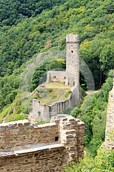 Ruins of the castle Philippsburg on a hill spur above Eifel village of Monreal, Germany photo