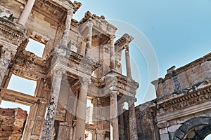 The ruins of Celsus Library in Ephesus at sunny evening sun. Beautiful light of the old ancient rocks and stones, turkey