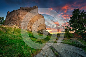 Ruins of Chojnik Castle in Karkonosze mountains at sunset. Poland