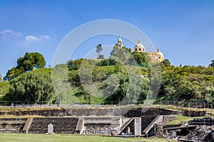 Ruins of Cholula pyramid with Church of Our Lady of Remedies at the top of it - Cholula, Puebla, Mexico