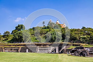 Ruins of Cholula pyramid with Church of Our Lady of Remedies at the top of it - Cholula, Puebla, Mexico