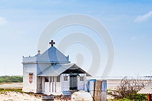 Ruins of the city of Danushkodi. Fishermen`s huts among the ruins.