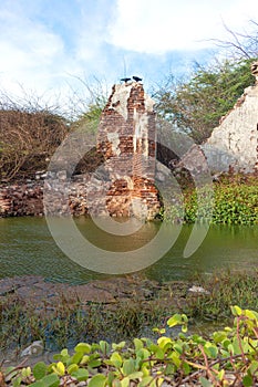 Ruins of the city of Danushkodi. Fishermen`s huts among the ruins.