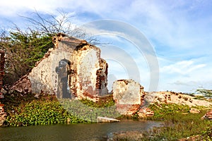 Ruins of the city of Danushkodi. Fishermen`s huts among the ruins.