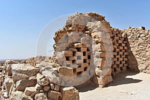 Ruins of a columbarium tower at the ancient Masada, Southern district, Israel.