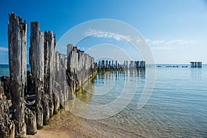 Ruins of concrete torpedo launching station in sea water