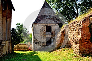 Ruins. Courtyard of the fortified medieval saxon evangelic church in the village Felmer, Felmern, Transylvania, Romania.