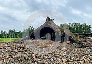 Ruins of the crematorium at the Auschwitz concentration camp Poland with blue sky