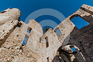 Ruins of the Doria Castle in Dolceacqua, arches, windows and walls, daytime, Italy