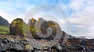 Ruins of Dunluce Castle on the edge of cliff. Filming location of popular TV show