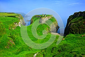 Ruins of Dunseverick Castle atop green cliffs of the Causeway Coast, Northern Ireland