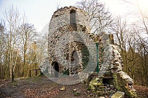 Ruins of a fieldstone water tower in the forest