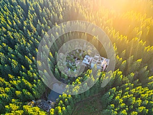 Ruins of former tin mine in the forest from above