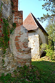 Ruins. Fortified medieval saxon evangelic church in the village Felmer, Felmern, Transylvania, Romania. photo