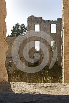 Ruins framed in a window.