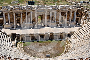 Ruins of the front facade of the antique Greek amphitheatre in Hierapolis, Pamukkale, Turkey