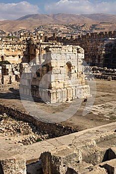 Ruins of great court of Heliopolis with mountains in the background in Baalbek vertical, Bekaa valley Lebanon