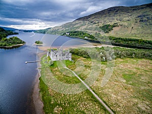 The ruins of historic Kilchurn Castle and jetty on Loch Awe