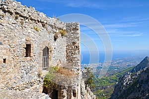 Ruins of historical Saint Hilarion Castle in Northern Cyprus overlooking the Mediterranean sea and its coast by the city Kyrenia.