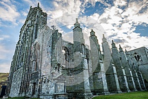 The ruins of Holyrood Abbey still stand tall and proud behind the Queen`s Gallery Palace in Edinburgh Scotland