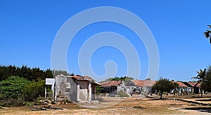 Ruins of homes and huts in a town following natural disaster, calamity, and war - Mass Destruction and Damage