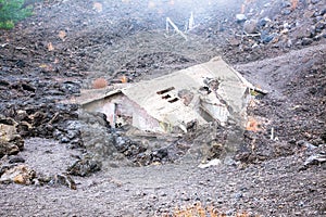 Ruins of a house that was buried under lava on Etna region , Sic