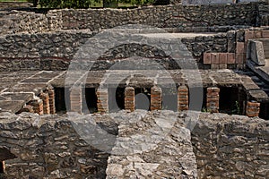 ruins of a hypocaust, an ancient underfloor heating system developed by the Romans.