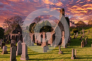 The Ruins of Kirkoswald Church & Graveyard Ayrshire with a blazing red Sunset made famous by Robert Burns