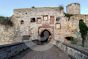 Ruins of the knight`s castle with a stone bridge to the gate