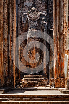 Ruins of Lankatilaka Vihara temple with Buddha image. Pollonaruwa, Sri Lanka