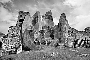 Ruins of medieval castle in Europe. Black and white photography of Medieval ruins castle. View of Likava castle in Likavka.