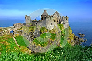 Ruins of the medieval Dunluce Castle and cliffs of the Causeway Coast, Northern Ireland