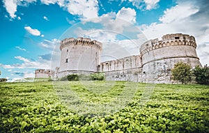 Ruins of medieval old tower of castle under blue sky in Matera Italy