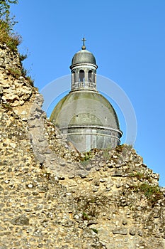 Ruins of medieval walls and dome of a historic church in the city of Provins