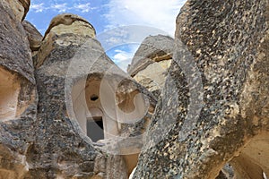 The ruins of monastic cells of an old ancient cave temple in the mountain valley of Cappadocia