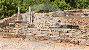 Ruins of the Nymphaion or Nymphaeum a monumental fountain in ancient Olympia, Greece photo