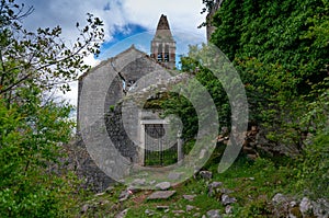 The ruins of an old abandoned Catholic church Stara Zupna Crkva on Mount Vrmac, the town of Prcanj, the Bay of Kotor, Montenegro