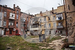 Ruins of an old abandoned city. Ruined house in which poor peopl