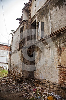 Ruins of an old abandoned city. Ruined house in which poor peopl