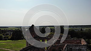 ruins of old ancient castle building in europe, shot from drone above, aerial archaelogy
