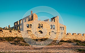 Ruins of an old brick factory. Destroyed industial plant photo