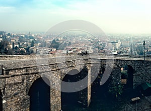 Ruins of old bridge at old town Cita Alta of Bergamo town in Italy